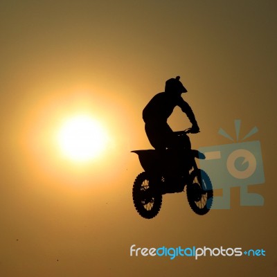 Motorcycle Jumps In The Air Stock Photo