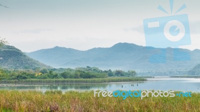 Mountain And Sky View Around Reservoir Stock Photo