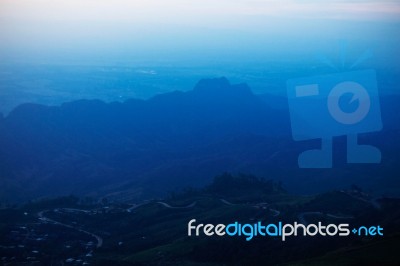 Mountain With Fog On The Sky Stock Photo