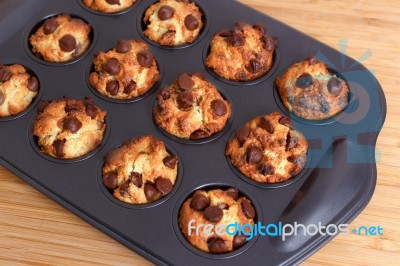 Muffins With Chocolate Chips In Baking Tray Stock Photo