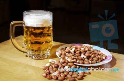 Mug Of Beer And Peanuts Stock Photo