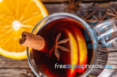 Mulled Wine And Spices On Weathered Wooden Table Stock Photo