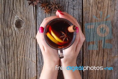 Mulled Wine And Spices On Weathered Wooden Table Stock Photo