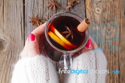 Mulled Wine And Spices On Weathered Wooden Table Stock Photo