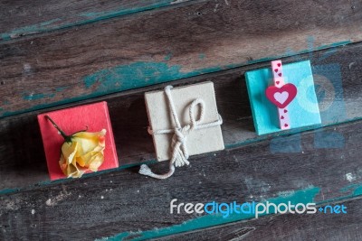 Multi-colored Gift Boxes On Wooden Stock Photo