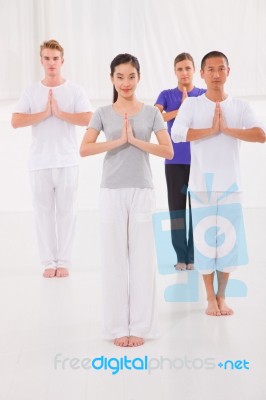 Multi Ethnic Group Of Happy People Doing Yoga Stock Photo