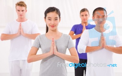 Multi Ethnic Group Of Happy People Doing Yoga Stock Photo