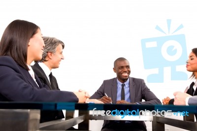 Multi Ethnic Team During Meeting Stock Photo