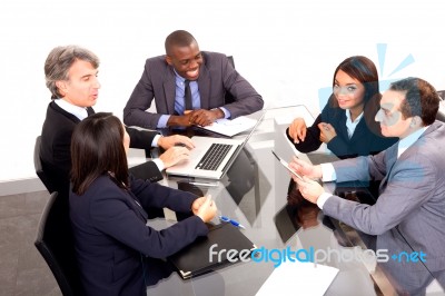 Multi Ethnic Team During Meeting Stock Photo