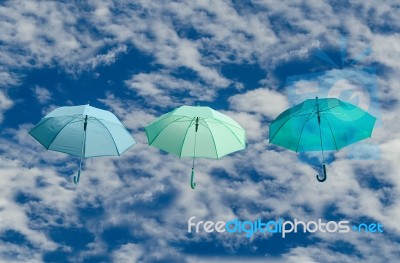 Multicolored Umbrellas Against  Blue Sky Background Stock Photo