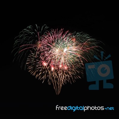 Multiple Firework Style Explode On Night Sky Stock Photo