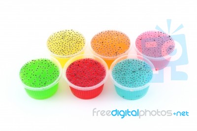 Multiple Jellies And Sweet Basil On Top In Plastic Cup Stock Photo