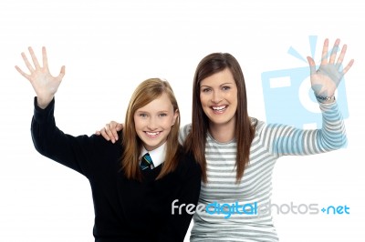 Mum And Daughter Waving Hands At The Camera Stock Photo