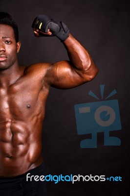 Muscular Man Flexing His Biceps Stock Photo