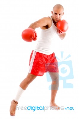 Muscular Man In Punching Pose Stock Photo