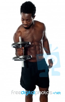 Muscular Man Lifting Dumbbell Stock Photo