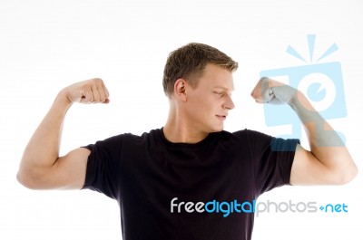 Muscular Man Looking His Muscles Stock Photo