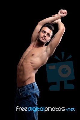 Muscular Young Man With On A Black Background Stock Photo