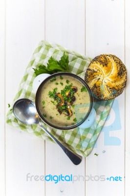 Mushroom Soup With A Bread Roll And Parsley Stock Photo