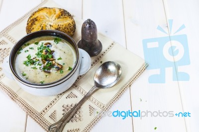 Mushroom Soup With A Bread Roll And Parsley Stock Photo