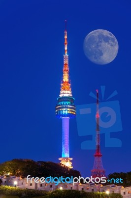 N Seoul Tower With Full Moon Located On Namsan Mountain In Central Seoul,south Korea Stock Photo