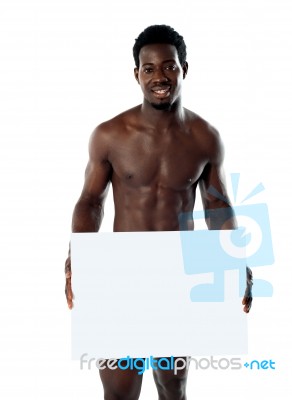 Naked Black Man with blank board Stock Photo