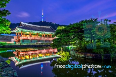 Namsangol Hannok Village And Seoul Tower Located On Namsan Mountain At Night In Seoul,south Korea Stock Photo