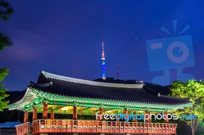 Namsangol Hannok Village And Seoul Tower Located On Namsan Mountain At Night In Seoul,south Korea Stock Photo