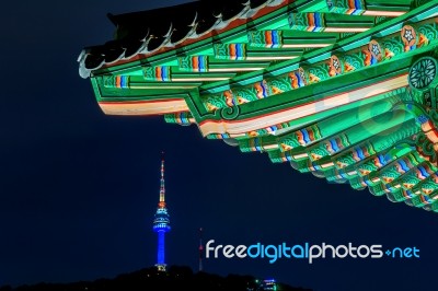 Namsangol Hannok Village And Seoul Tower Located On Namsan Mountain At Night In Seoul,south Korea Stock Photo