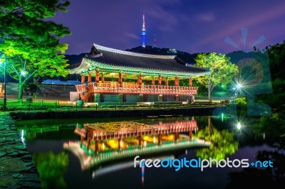 Namsangol Hannok Village And Seoul Tower Located On Namsan Mountain At Night In Seoul,south Korea Stock Photo