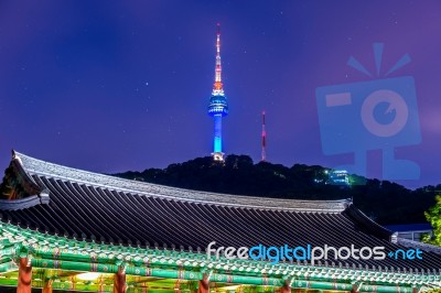 Namsangol Hannok Village And Seoul Tower Located On Namsan Mountain At Night In Seoul,south Korea Stock Photo