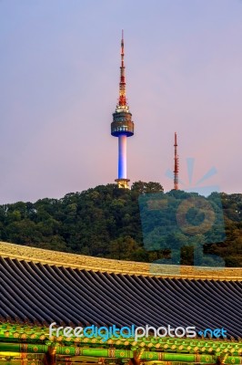 Namsangol Hannok Village And Seoul Tower Located On Namsan Mountain At Night In Seoul,south Korea Stock Photo