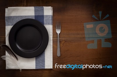 Napkin Dish Fork Feather Still Life Flat Lay Rustic Stock Photo