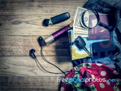 Necessary Object For Travelers In Denim Handbag Stock Photo