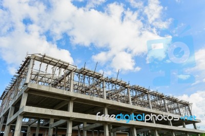 New High Construction Building Framing Against Blue Sky Stock Photo