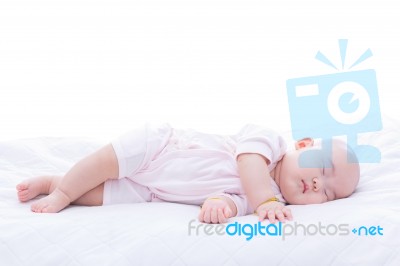 Newborn Baby Girl Sleeping In Bed Stock Photo