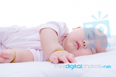 Newborn Baby Girl Sleeping In Bed Stock Photo