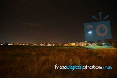 Night Public Park In The City With Houses Near Stock Photo