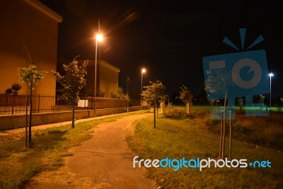 Night Public Park In The City With Houses Near Stock Photo