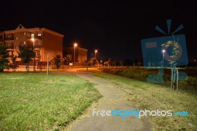 Night Public Park In The City With Houses Near Stock Photo