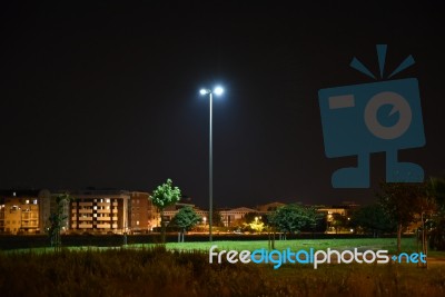 Night Public Park In The City With Houses Near Stock Photo