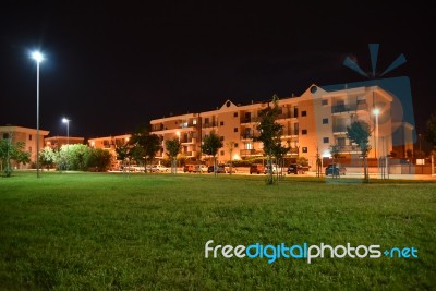 Night Public Park In The City With Houses Near Stock Photo