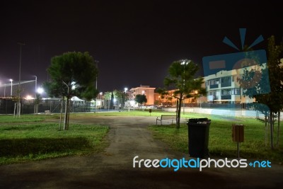 Night Public Park In The City With Houses Near Stock Photo