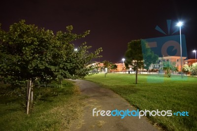 Night Public Park In The City With Houses Near Stock Photo