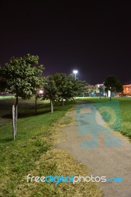 Night Public Park In The City With Houses Near Stock Photo