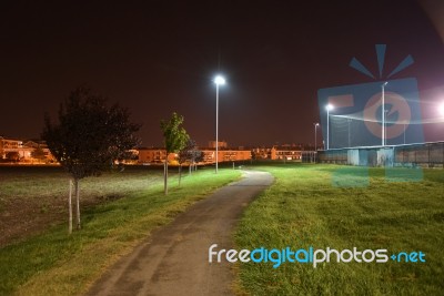 Night Public Park In The City With Houses Near Stock Photo