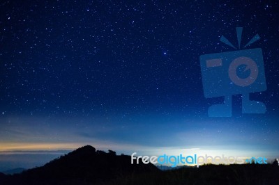 Night Sky With Star On Top Of Mountain Stock Photo