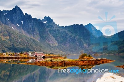 Norway Island In Fjord. Cloudy Nordic Day. Hotel On Island Stock Photo