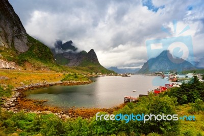 Norway Village On A Fjord. Nordic Cloudy Summer Day Stock Photo