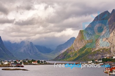 Norway Village On A Fjord. Nordic Cloudy Summer Day Stock Photo